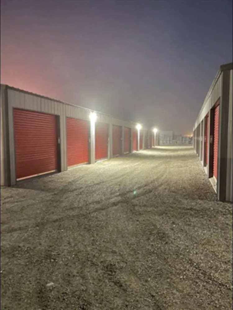 Storage unit drive aisle lit up at dusk